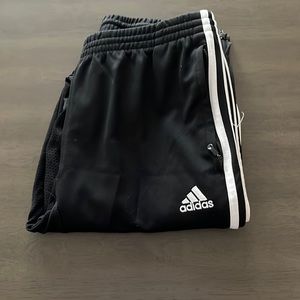 Adidas black and white jogger type athletic pants size medium 2 zipper pockets